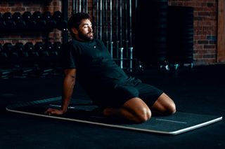 Director of Flexibility Cody Mooney demonstrates the hamstring stretch