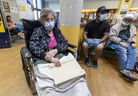 A woman sits in a wheelchair in the emergency room waiting room at Lakeshore General Hospital in Pointe-Claire on June 1, 2023.